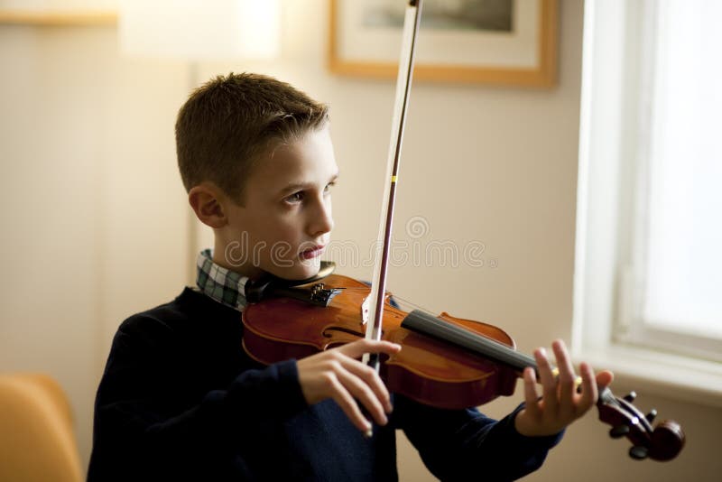 Young boy playing violin