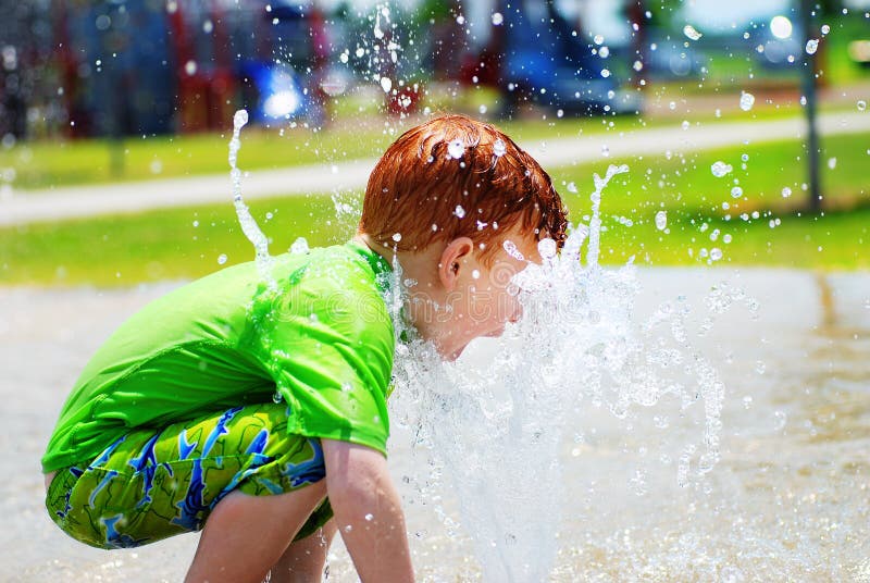 Young boy playing in water stock photography Young boy playing in water stock photography