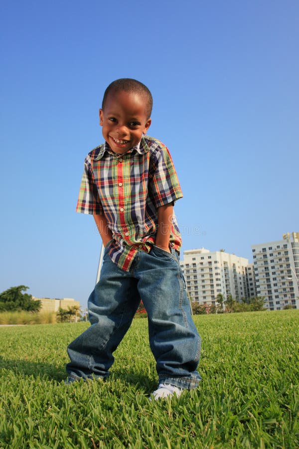 Young Boy Posing on the Grass