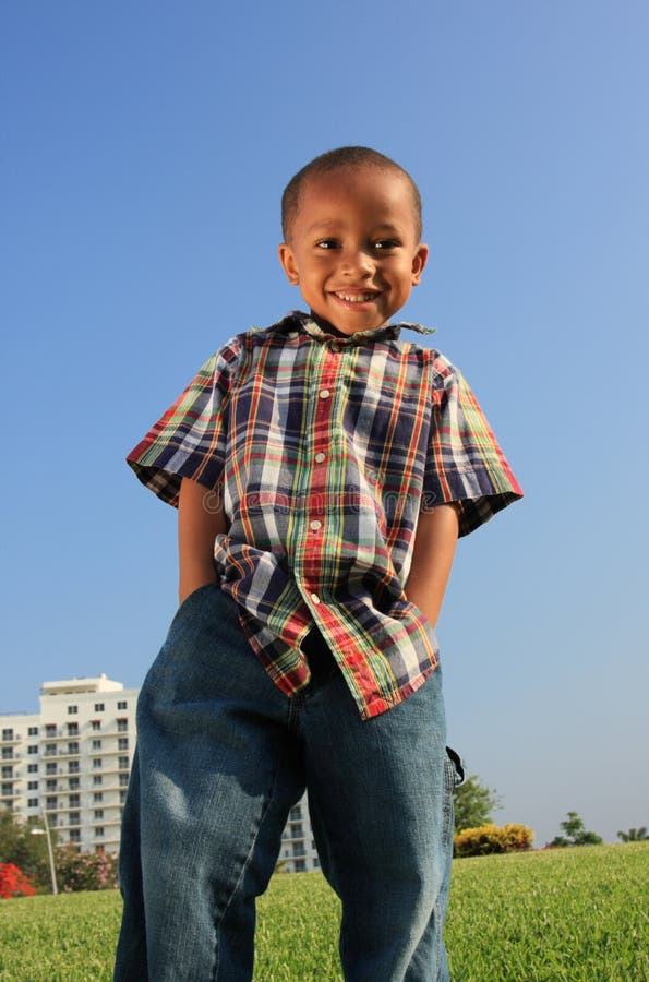 Young Boy Posing on the Grass