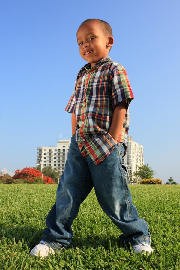 Young Boy Posing on the Grass
