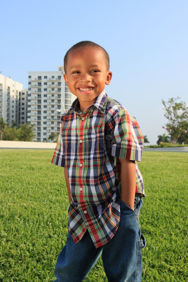 Young Boy Posing on the Grass