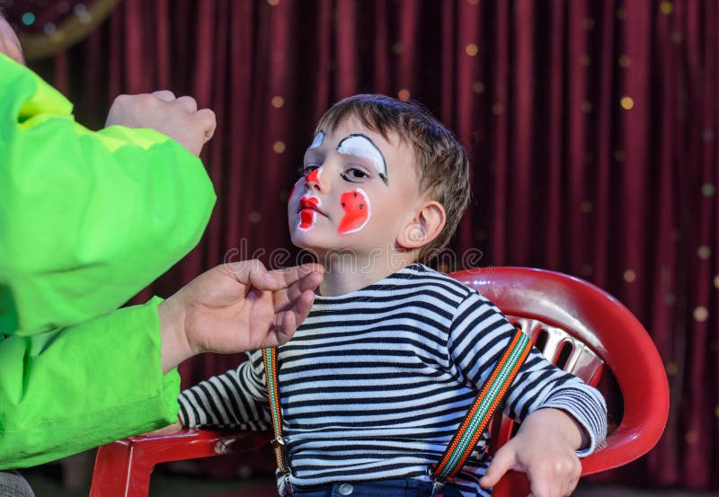 Young Boy Putting Mime Makeup for a Stage Play