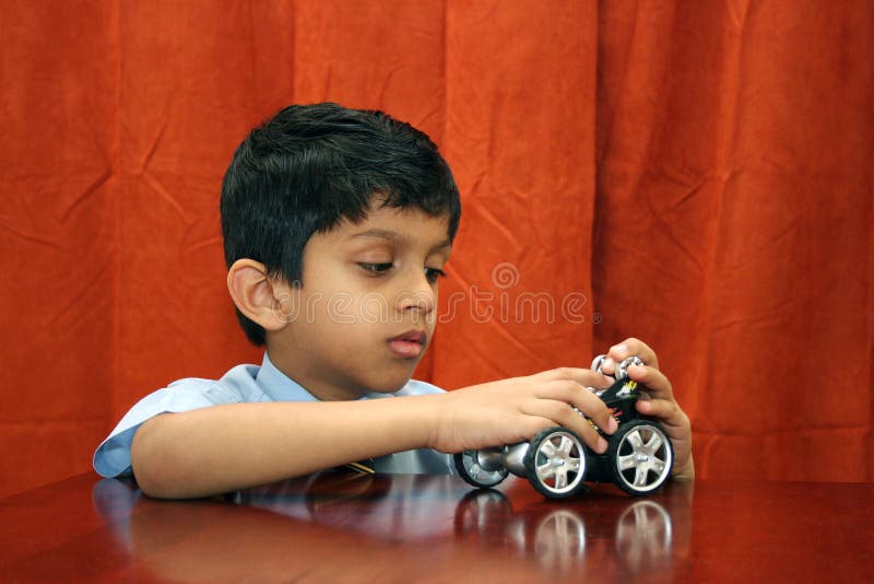 Young boy repairing toy car royalty free stock photo Young boy repairing toy car royalty free stock photo