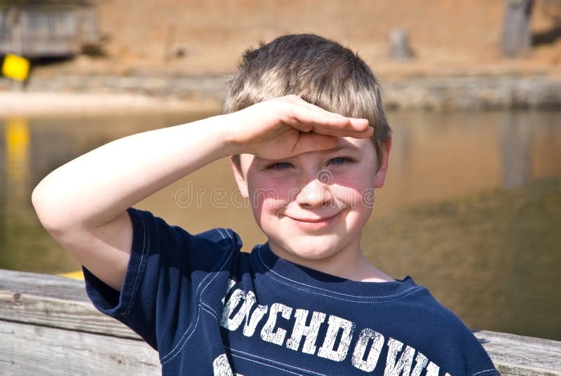 Young Boy Shading His Eyes