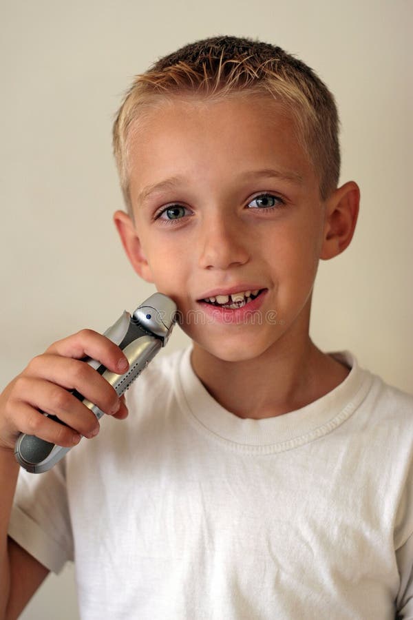 Young boy shaving stock photo. Image of emotion, person 1404094