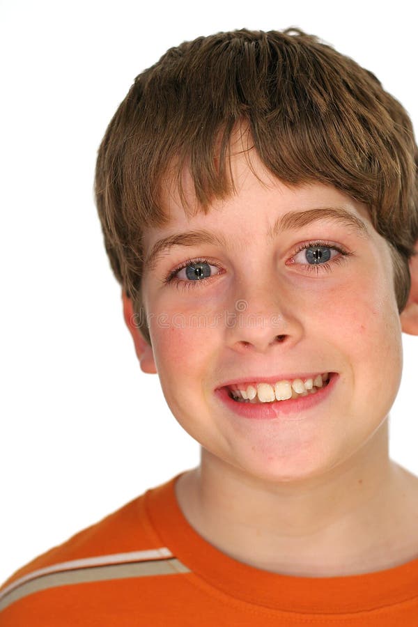 Young boy smiling on white stock images