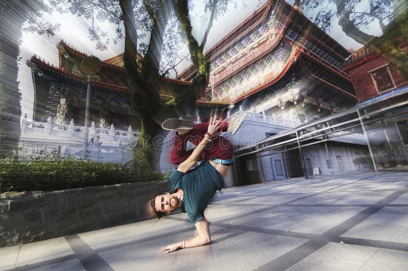 A young boy standing on a hand on a background of the Chinese Temple.