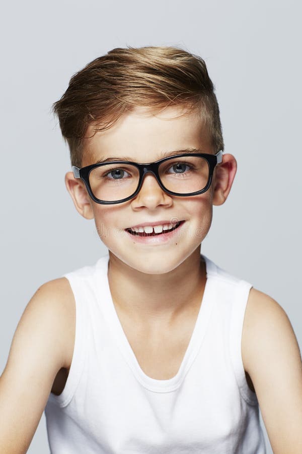 Young Boy in Studio, Smiling Stock Image - Image of eyeglasses, boys ...