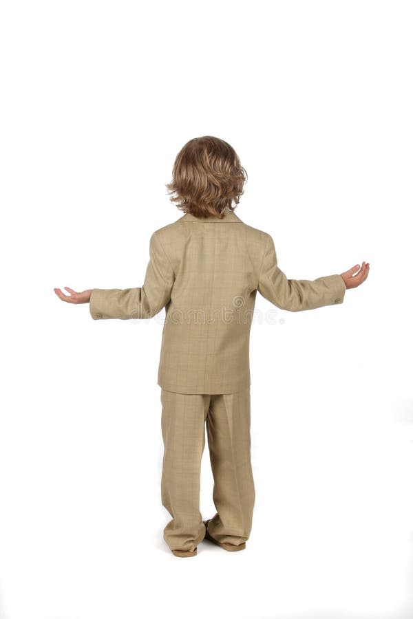 Young boy in suit with arms out