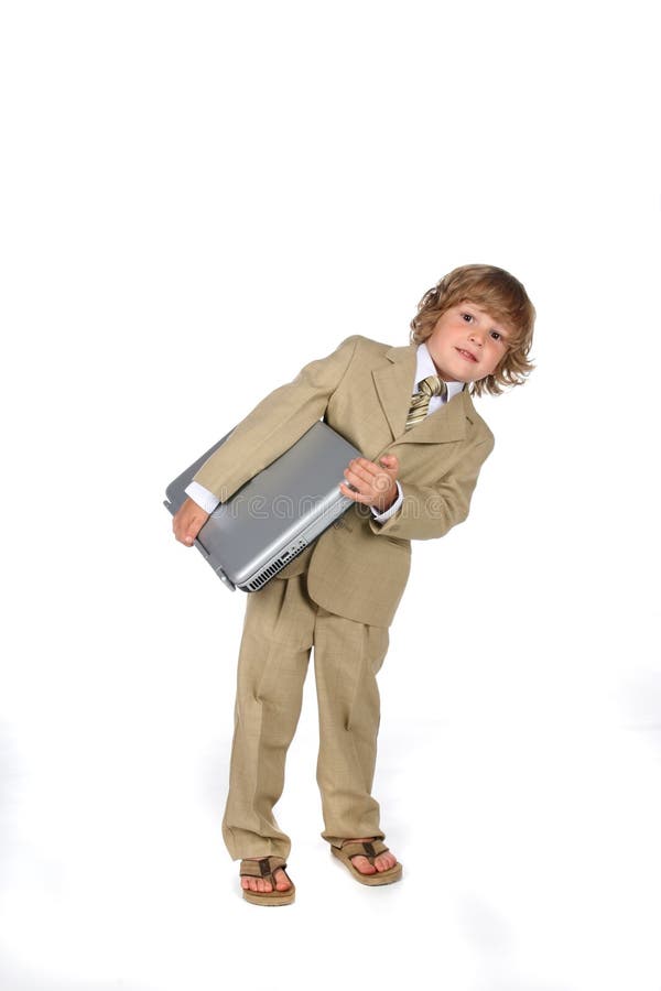 Young boy in suit with laptop