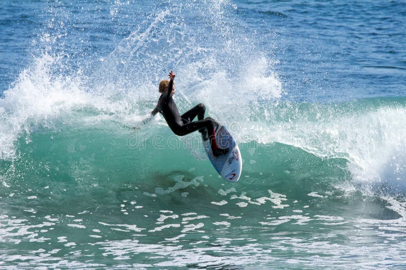 Young Boy Surfing a Wave in California royalty free stock photo Young Boy Surfing a Wave in California royalty free stock photo