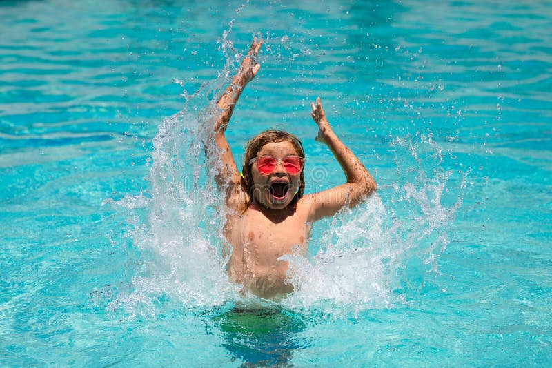 Young Boy Swim in Pool. Child Boy Rest in Swimming Pool. Stock Photo