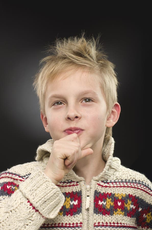 Young Boy Thinking, Wondering on Black Background. Stock Image Image