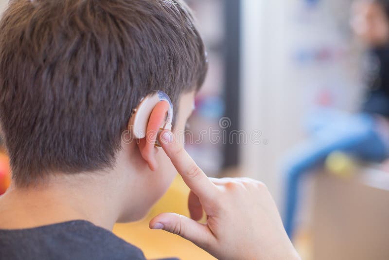 Young Boy Using Hearing Aid Stock Photo Image of diagnostic, deaf