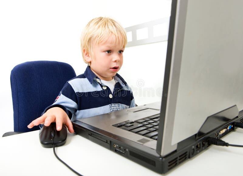 The computer is he. Boy is sitting near the Laptop.