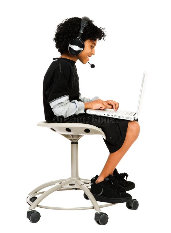 Young Boy Using Laptop and Headset