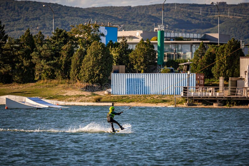 Young boy wakeboarding on a lake