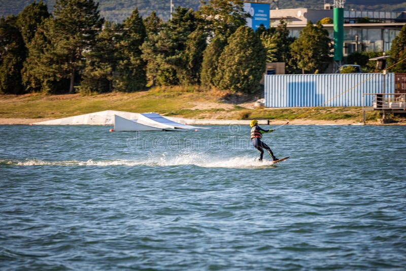 Young boy wakeboarding on a lake