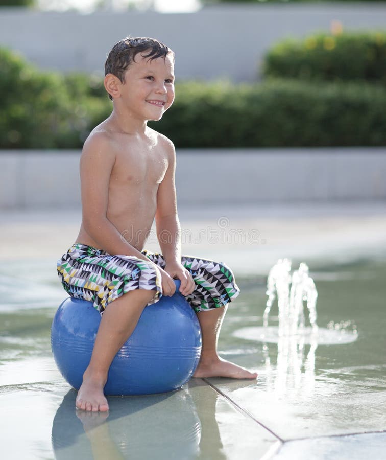 Young Boy Playing At The Indoor Water Park Stock Photo 