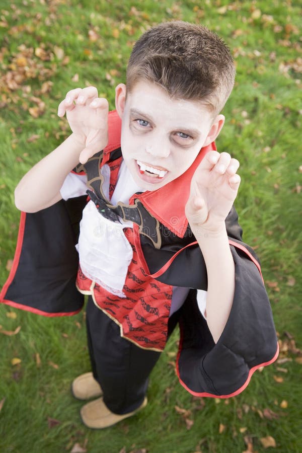 Boy In Halloween Vampire Makeup Costume Stock Photo - Download