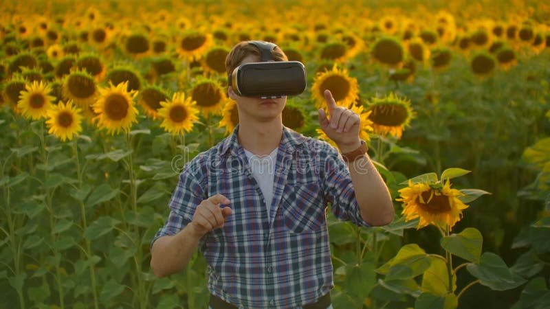 The boy is working in VR glasses