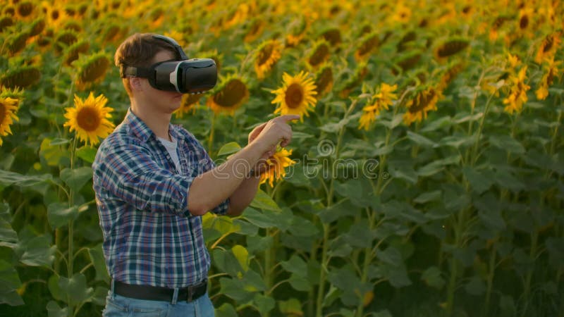 The young boy is working in VR glasses