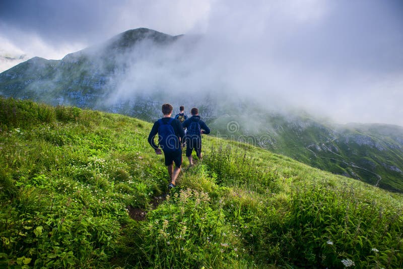 Young boys during a mountain hike Concept of healthy lifestyle royalty free stock images