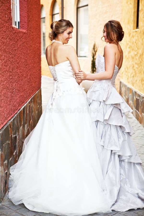 Young Bride And Bridesmaid in an Alleyway