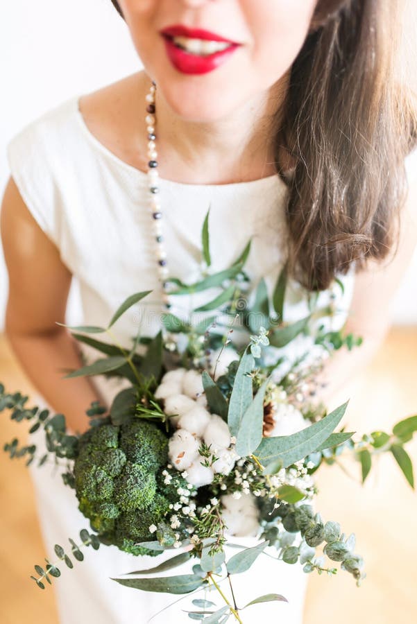 Young bride with modern foodie bouquet royalty free stock images Young bride with modern foodie bouquet royalty free stock images