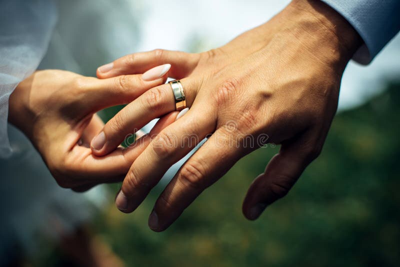 Close up of a bride and groom purposing ring sharing during traditional  wedding ceremony in India Stock Photo - Alamy