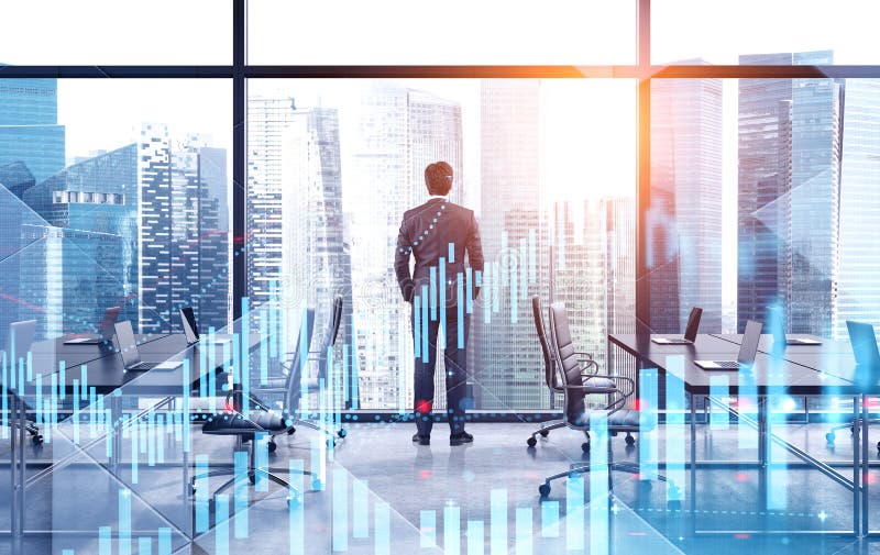 Young broker working in office, digital graphs stock photos Young broker working in office, digital graphs stock photos