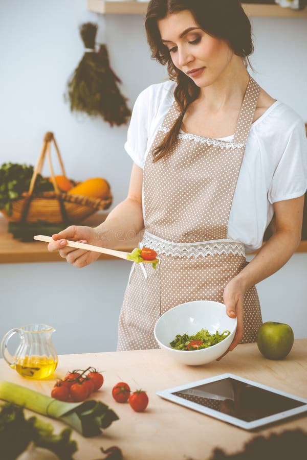 Young Brunette Woman Cookin