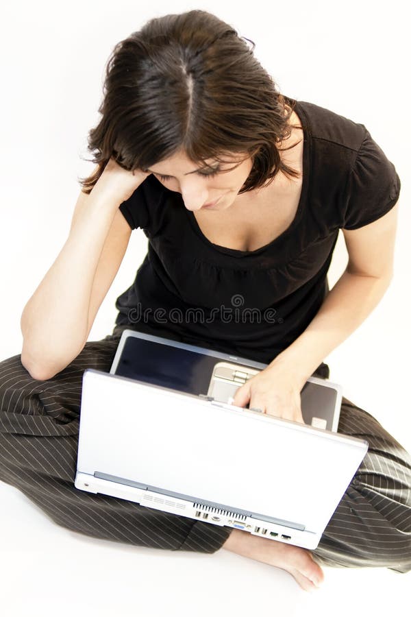 Young Brunette Woman Works At Computer