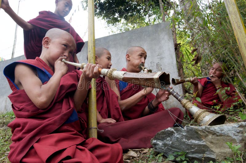 Young Buddhist Monks Playing Horns