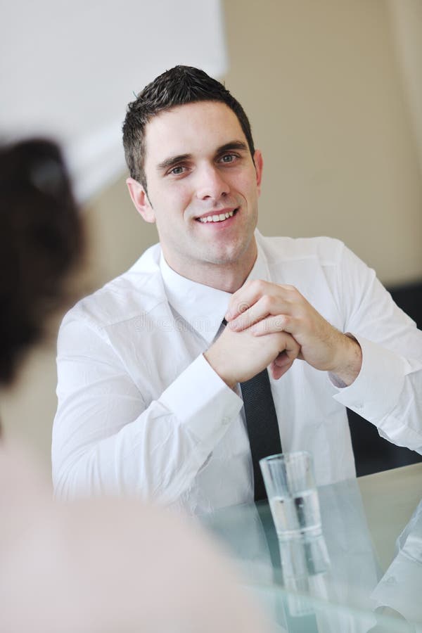 Young business man alone in conference room