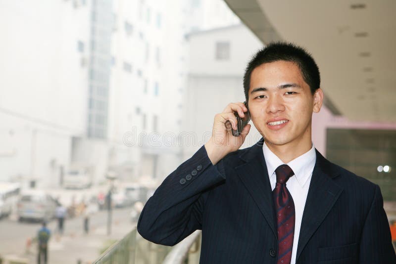 Young business man holding mobile phone stock images