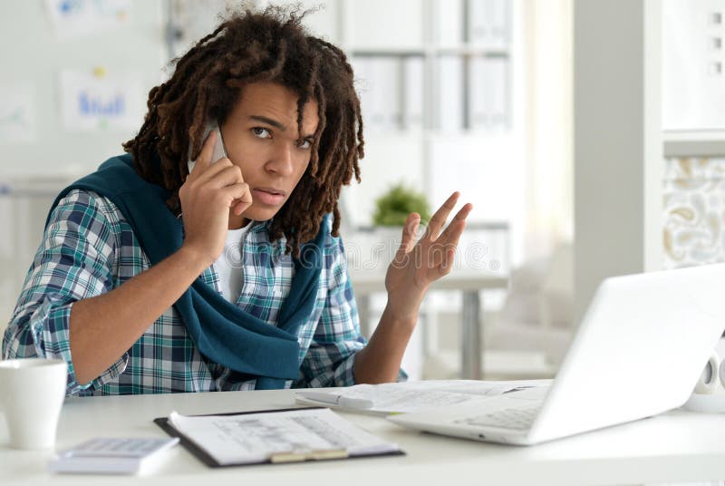 Young business man with laptop working