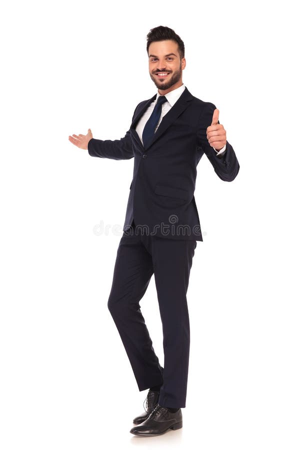 Young business man presenting and making the ok hand sign