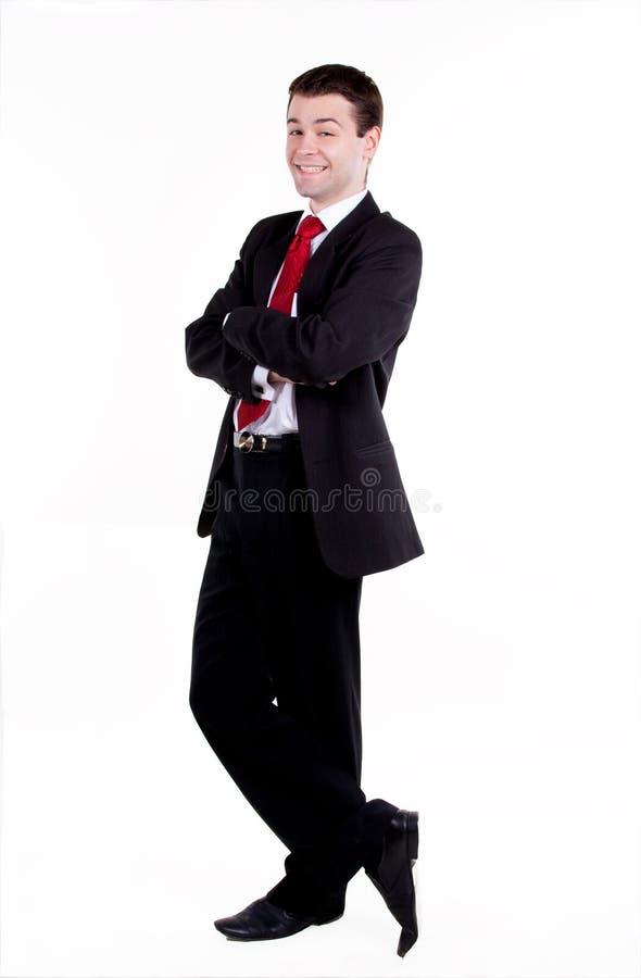 Young business man standing with arms crossed stock photo