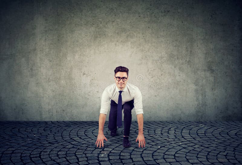Young business man in the starting position royalty free stock photography Young business man in the starting position royalty free stock photography
