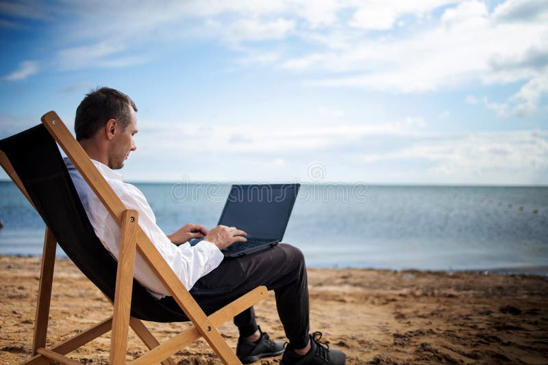 Young Man with Tablet Computer during Tropical Beach Vacation ...