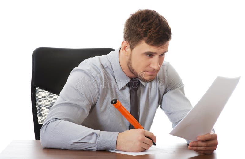 Young business man writing a note.