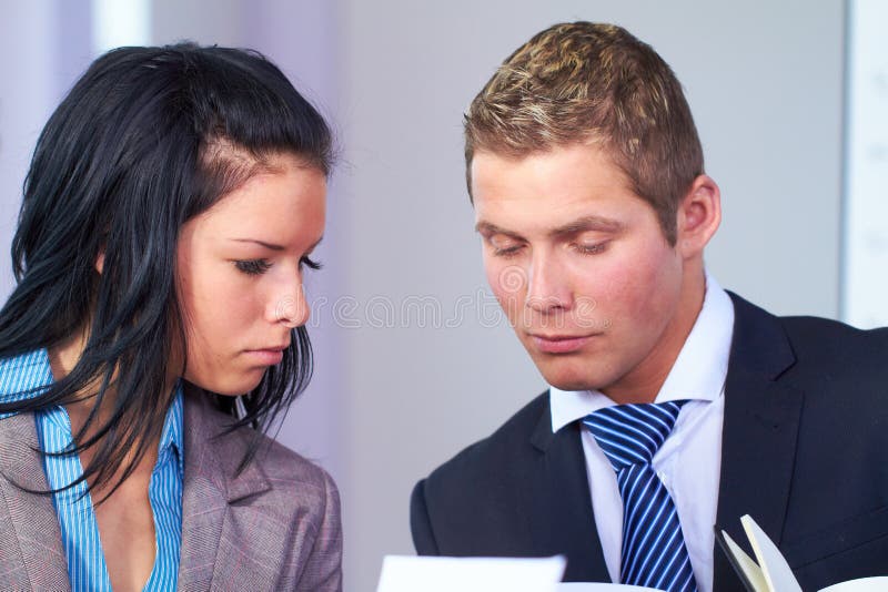 Young business people discuss something stock photo Young business people discuss something stock photo