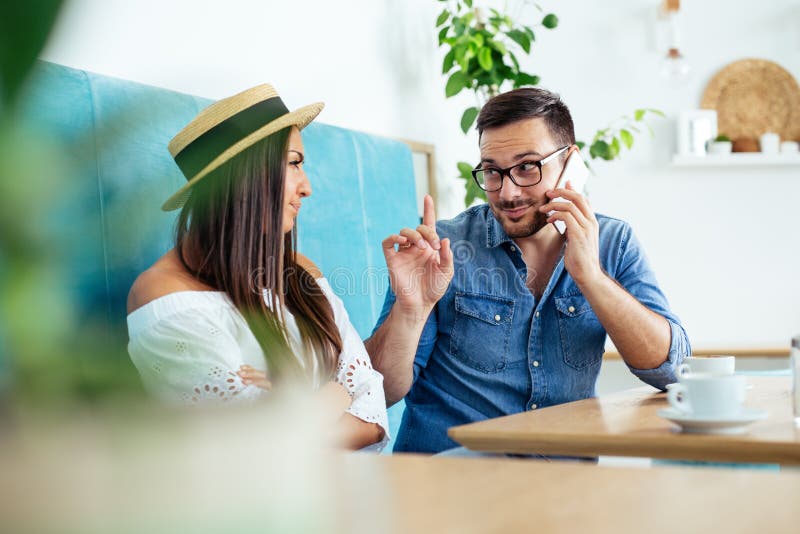 Business team working on laptop at coffee bar. - Image stock images Business team working on laptop at coffee bar. - Image stock images