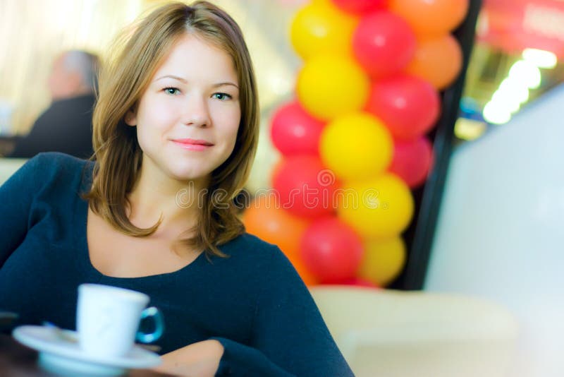 Young business woman drinking coffee