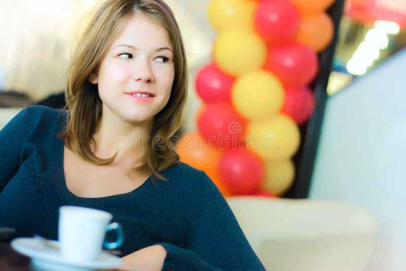 Young business woman drinking coffee