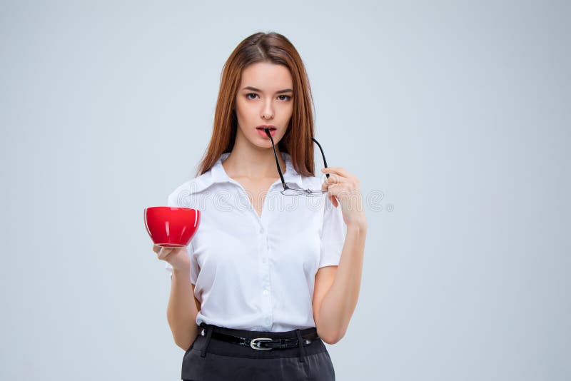 The young business woman on gray background royalty free stock photo The young business woman on gray background royalty free stock photo