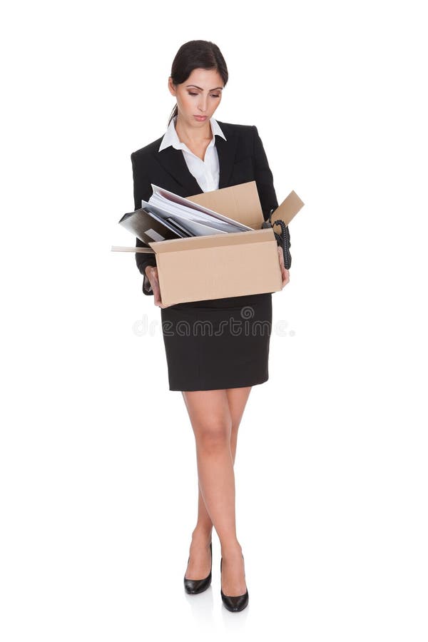 Young Business Woman Holding A Box Of Documents. Isolated On White