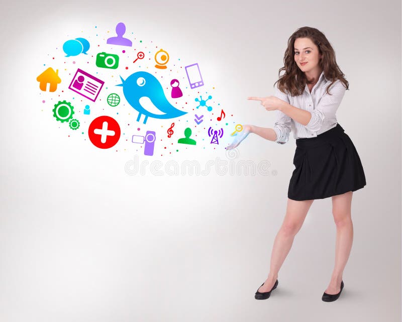 Young business woman presenting colourful social icons royalty free stock photos Young business woman presenting colourful social icons royalty free stock photos